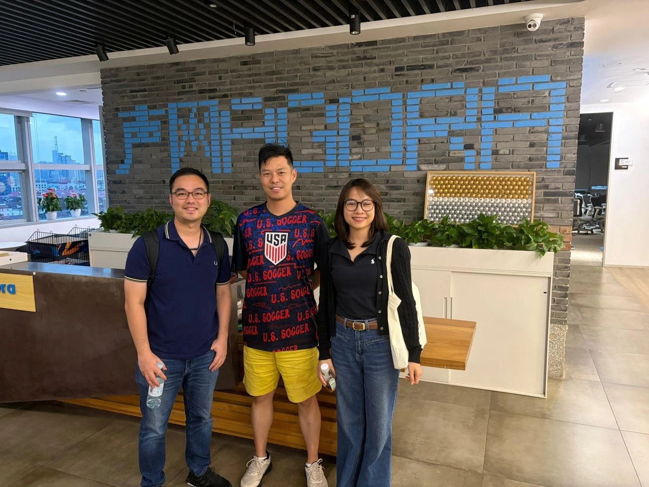 GenAI Fund team with an Agora host in front of the Agora logo