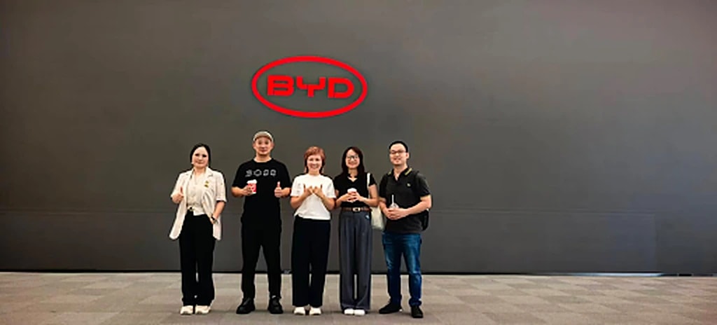 GenAI Fund team in front of the BYD logo