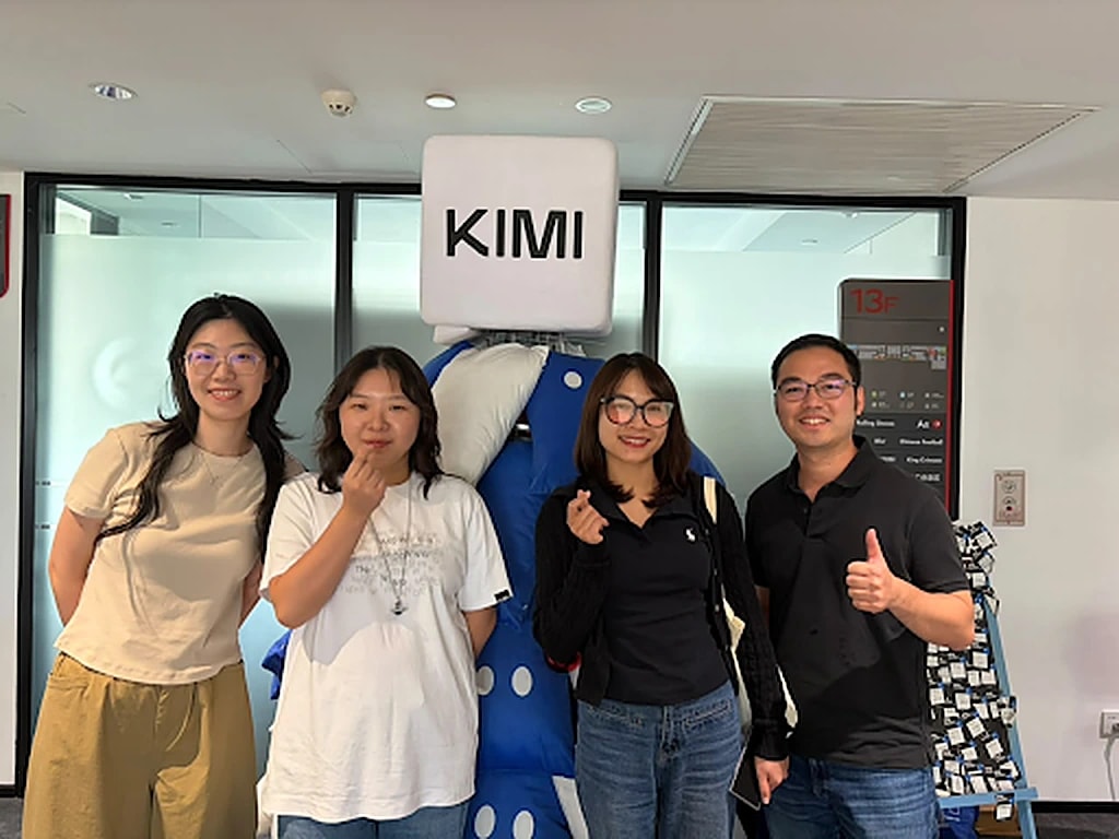 GenAI Fund team with Kimi staff beside the Kimi mascot